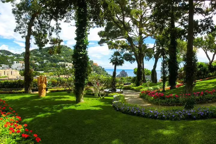 Lush gardens with vibrant flowers and sea views in Anacapri, perfect for a serene tour experience.
