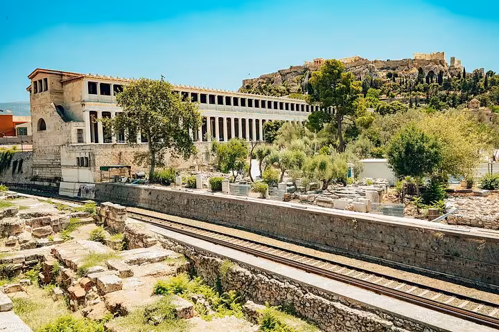 Ancient Agora ruins and Athens skyline near Acropolis, scenic stop on small group Athens walk and taste tour