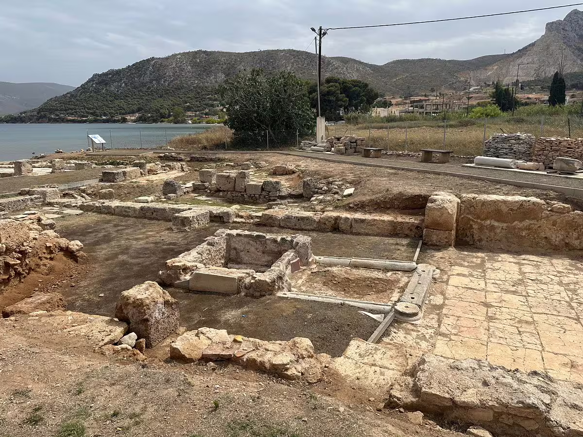 Ancient harbor-side ruins near Corinth with mountain views, visited on a private biblical tour from Athens