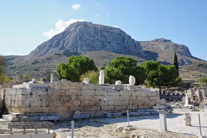 Ancient Corinth ruins with Acrocorinth mountain backdrop, highlight of Corinth Canal half-day private tour