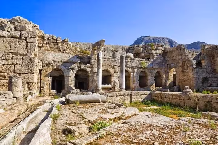 Ancient Corinth archaeological ruins and stone arches, visited on St Paul’s Footsteps ToThe Corinthians 6-hour tour