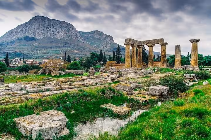 Ancient Corinth Temple of Apollo ruins with Acrocorinth backdrop on a private biblical Greece day tour