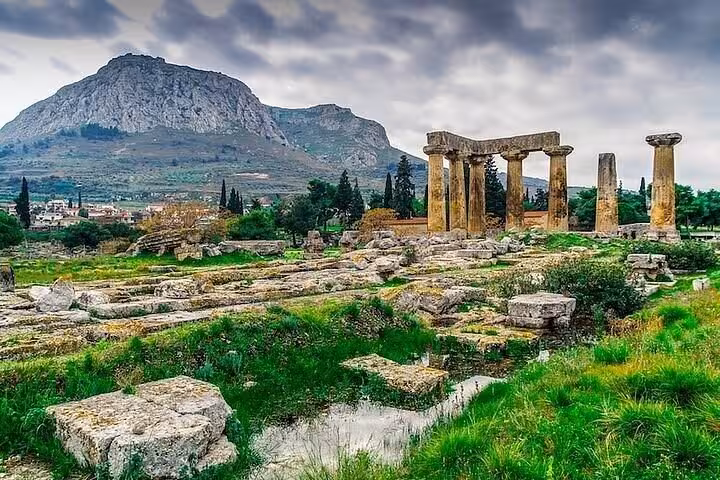Ancient Corinth Temple of Apollo ruins with Acrocorinth backdrop, biblical history tour with wine and oil tasting
