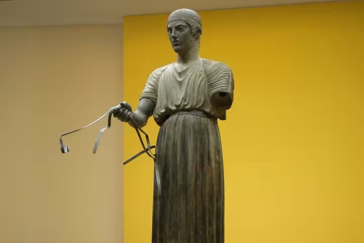 Ancient Greek bronze statue in museum, cultural stop on Meteora and Delphi 2-day luxury private tour from Athens