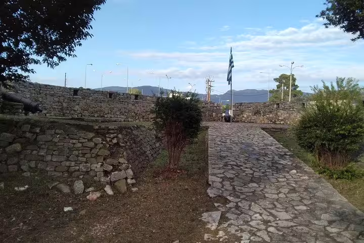 Stone walkway at Ancient Plevrona fortress walls near Messolonghi, scenic stop on day tour with meal