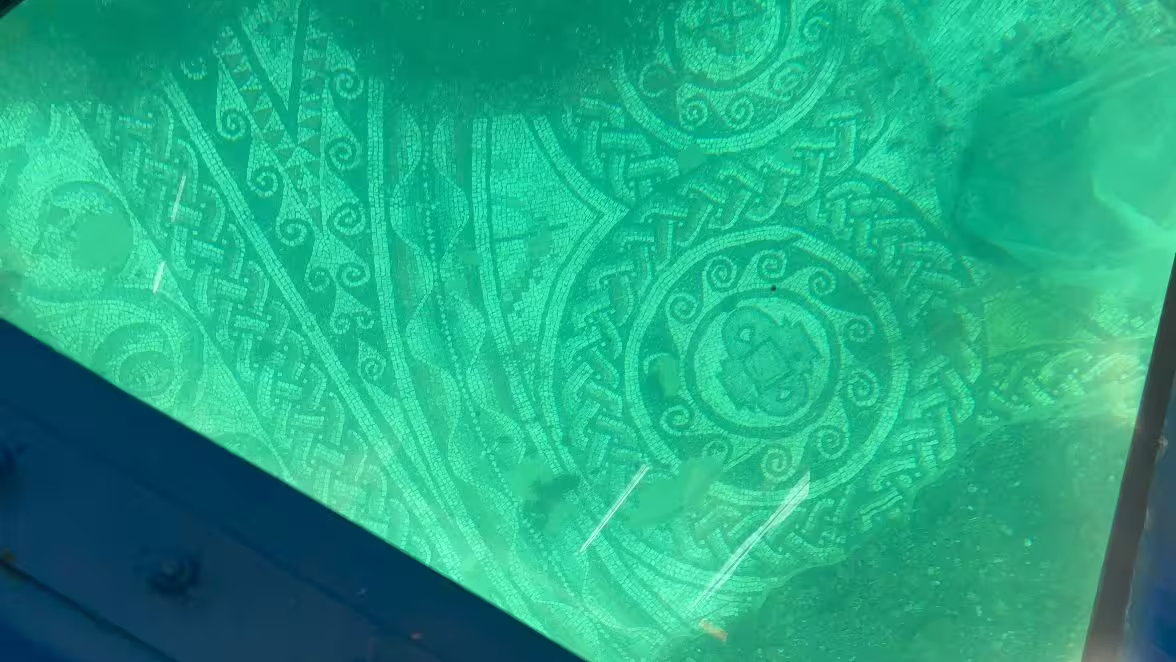 Ancient Roman mosaic beneath Baia Sommersa, viewed through glass-bottom boat on Archeoemotions tour