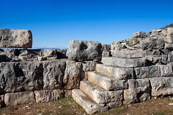 Ancient stone steps and fortification ruins on the 2-day private Greece tour to Plevrona, Oiniades and Delphi