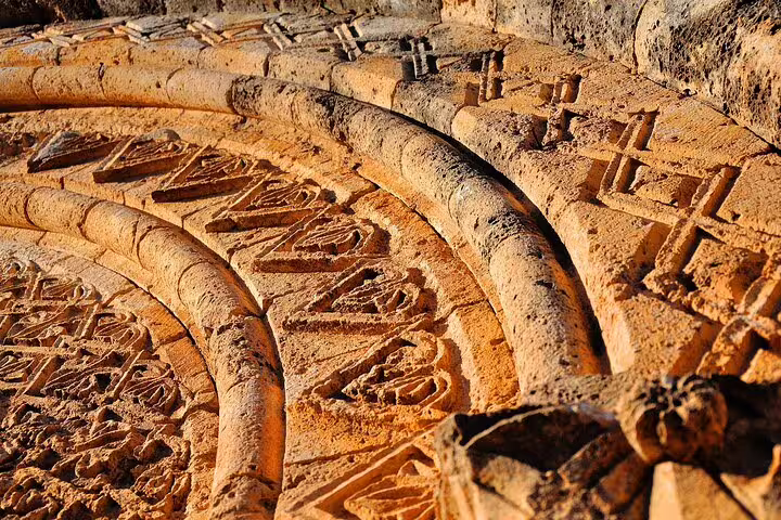 Close-up of ancient stone carvings and Christian symbols in Stilo, Calabria, on a private tour of Byzantine sacred art