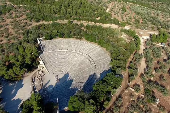 Aerial view of Ancient Theatre of Epidaurus in lush forest, highlight of Argolis private full day tour
