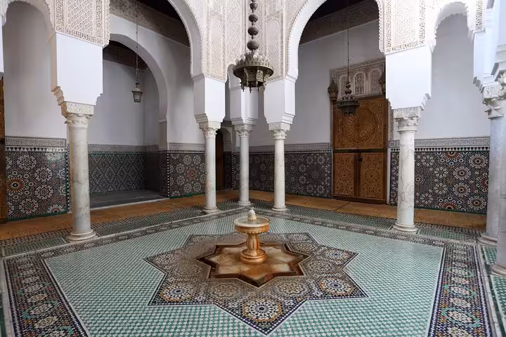 Intricate Moorish architecture with ornate tiles and arches in an Andalucian courtyard, ideal for cultural exploration.