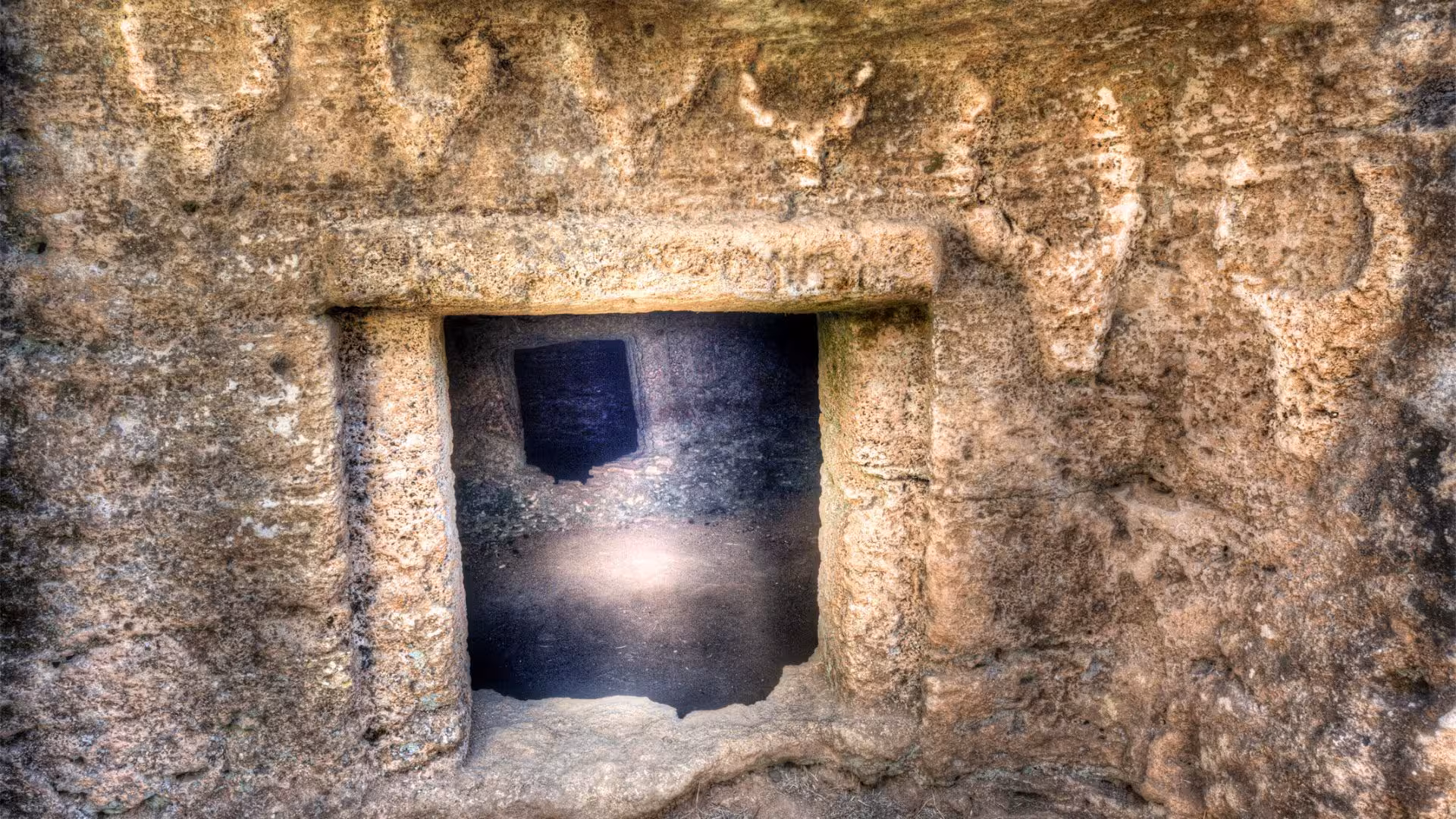 Uncover the mysterious entrances of Anghelu Ruju Necropolis in Alghero, enhanced by informative audio guides.
