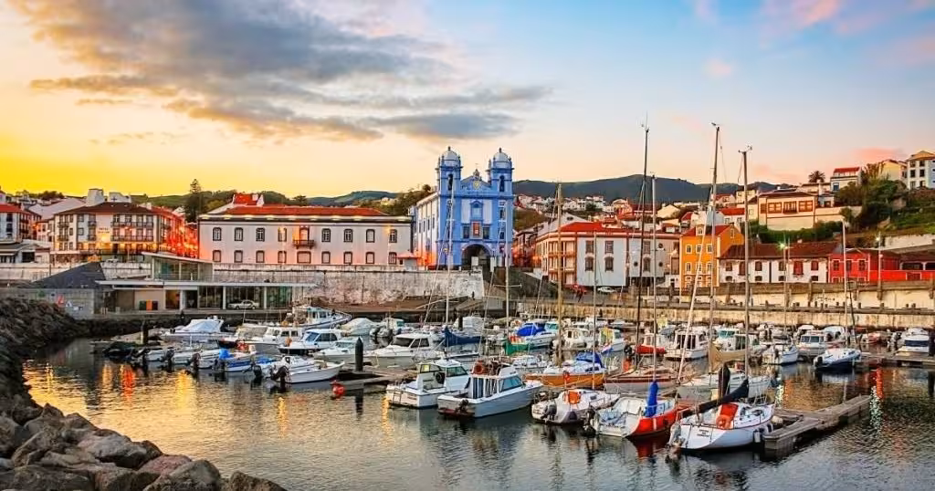 Angra do Heroísmo marina at sunset with yachts and waterfront buildings on a half-day walking tour in Terceira