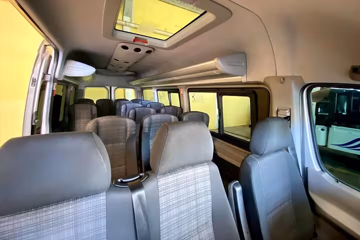 Interior view of a Paraty Tours shuttle showing comfortable seating for passengers traveling from Angra dos Reis to Paraty.
