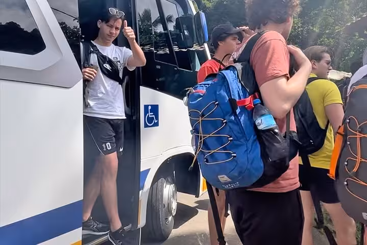 Travelers exiting a shuttle bus in Angra dos Reis, equipped for a convenient transfer to Rio de Janeiro.