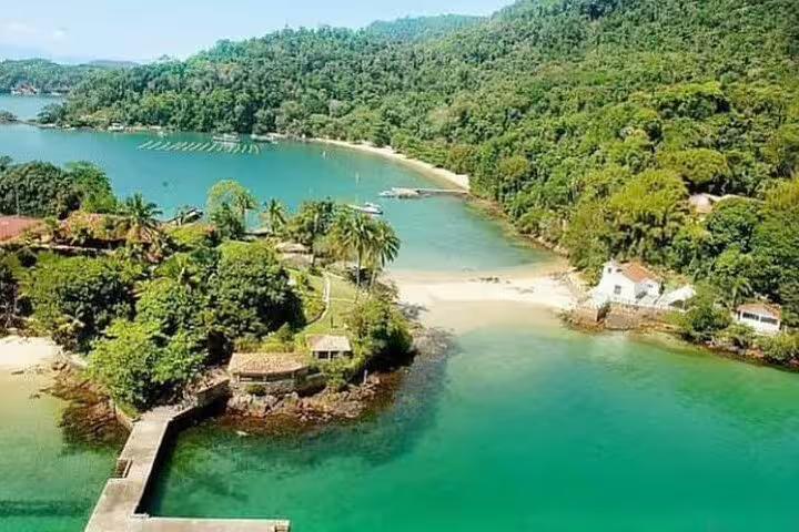 Scenic aerial view of tropical coastline and lush islands on Angra & Ilha Grande boat tour from Rio de Janeiro.
