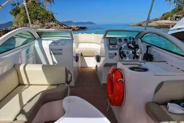 Luxurious private boat interior with stunning ocean view on Angra & Ilha Grande tour, promising comfort and adventure.