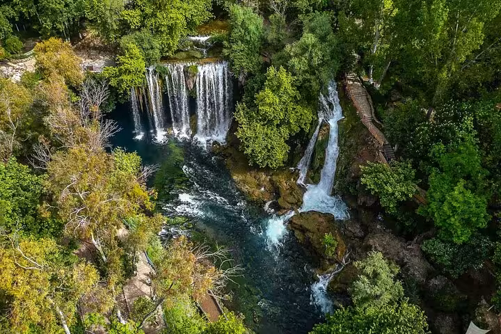 Aerial view of Antalya Düden Waterfalls cascading through lush forest, scenic stop on 8-day Touch of Mediterranean tour