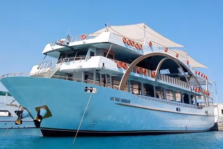 Large Antalya cruise boat docked on Turkey Mediterranean coast, full-day boat tour with lunch and sun deck