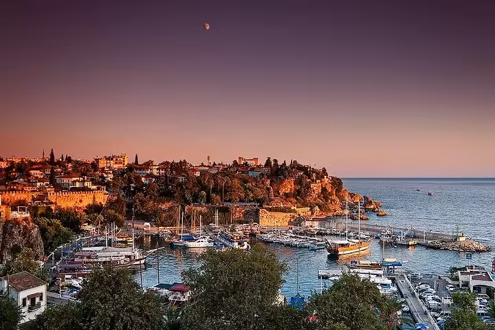 Sunset view of Antalya Old Town marina and yachts on the Mediterranean, highlight of all-inclusive city tour