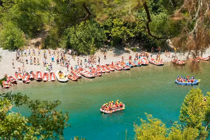 Aerial view of rafting base with rafts and teams on emerald river, popular Antalya rafting tour starting point