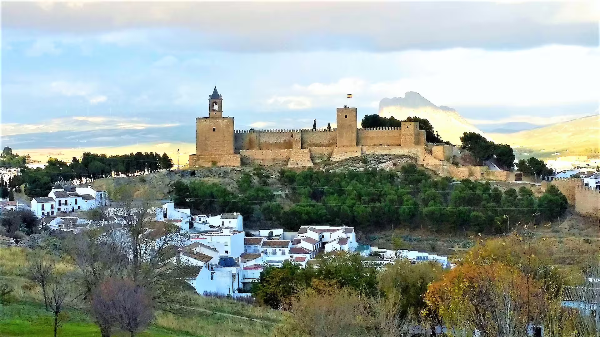 Panoramic view of Antequera Alcazaba fortress above whitewashed town on a private day trip from Costa del Sol