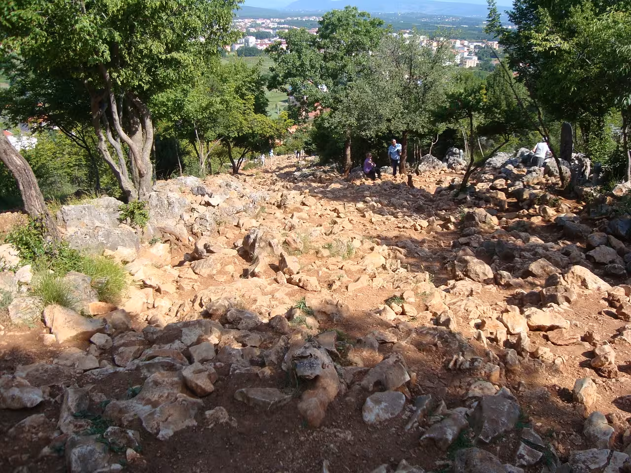 Rocky trail up Apparition Hill in Medjugorje, pilgrimage hike on Medjugorje Special from Split tour