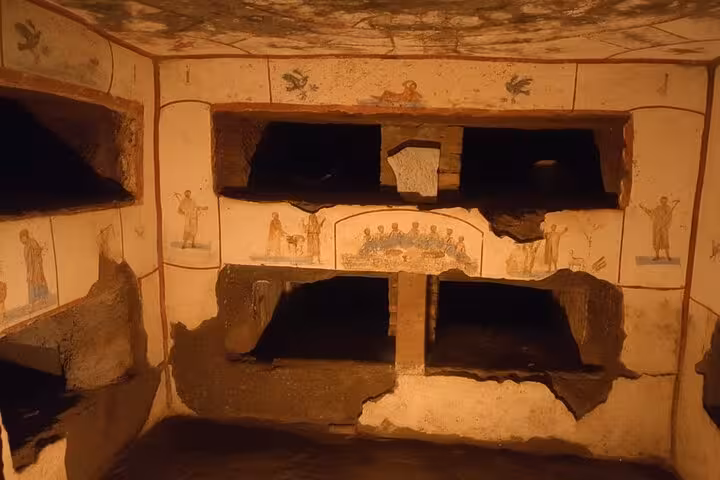 Experience the detailed frescoes and burial niches of the Christian catacombs on the Appian Way.
