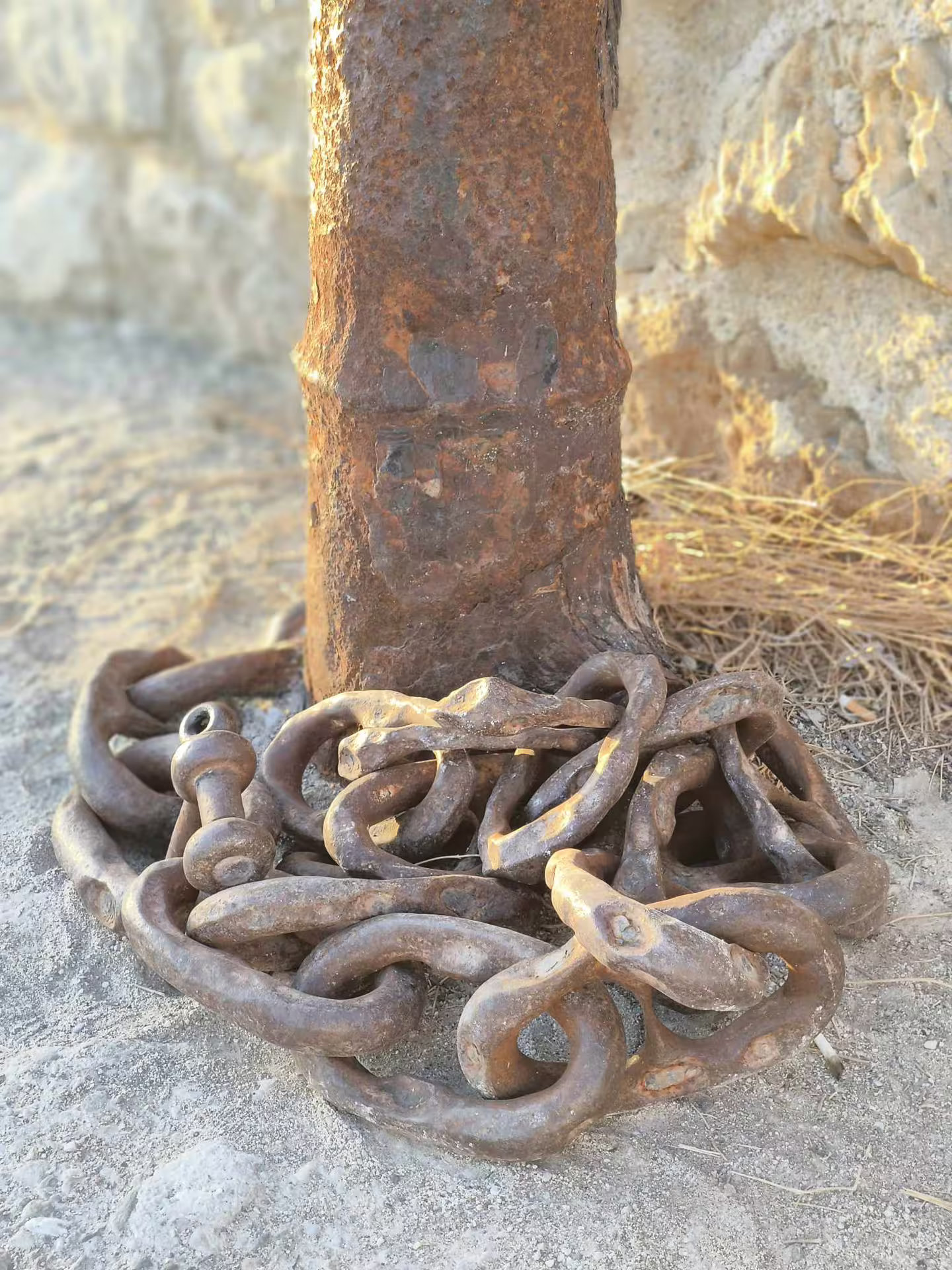 Rustic chains and post at ancient Aptera site, highlighting history on the Explore Aptera & Chania tour.