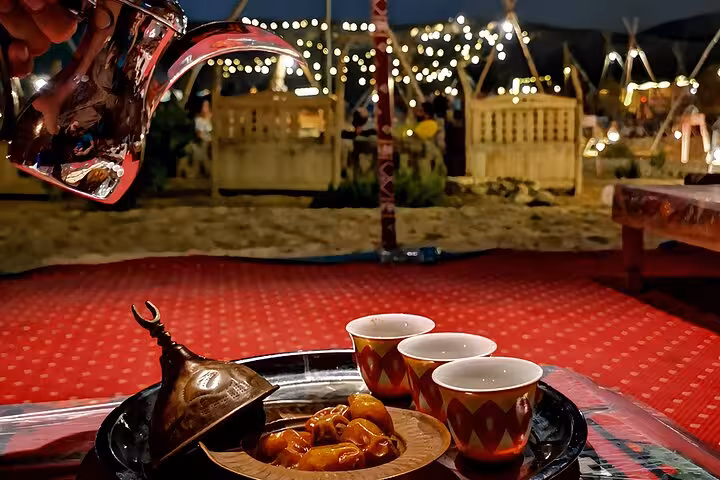 Arabic tea poured into cups at Giza Bedouin camp, VIP Arabian Night dinner show experience with photographer