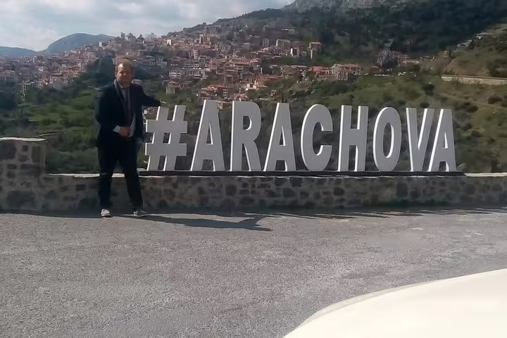 Scenic Arachova viewpoint near Delphi on a private full-day tour, with hillside village panorama in Greece