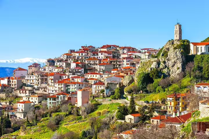 Arachova village with red-tiled roofs and clock tower near Delphi, popular stop on Delphi full day tour