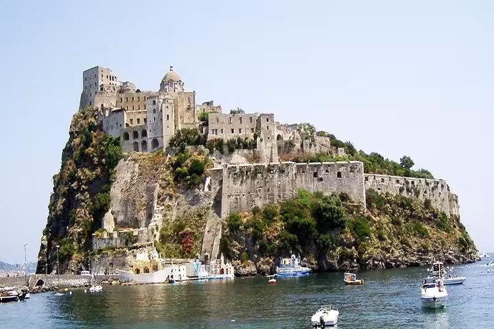 Historic Aragonese Castle overlooking the azure waters of Ischia, a highlight of the Sorrento boat tour.