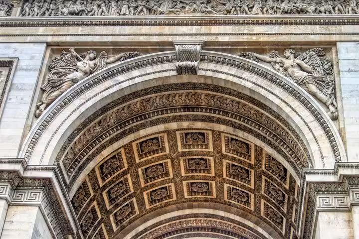 Close-up of Arc de Triomphe arch carvings on a private Paris walking tour near Champs-Élysées and macarons