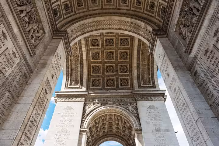 Inside view of Arc de Triomphe arch ceiling details on a private Champs-Élysées walking tour in Paris