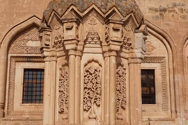 Ornate stone carvings on historic Armenian church near Mount Ararat, cultural stop on 7-day trek tour