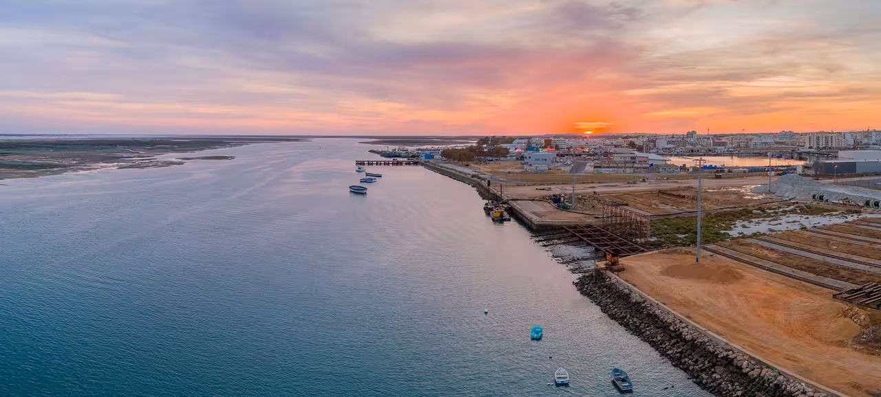 Sunset over Faro harbor and Ria Formosa channel, scenic Armona Route catamaran 1-hour boat tour