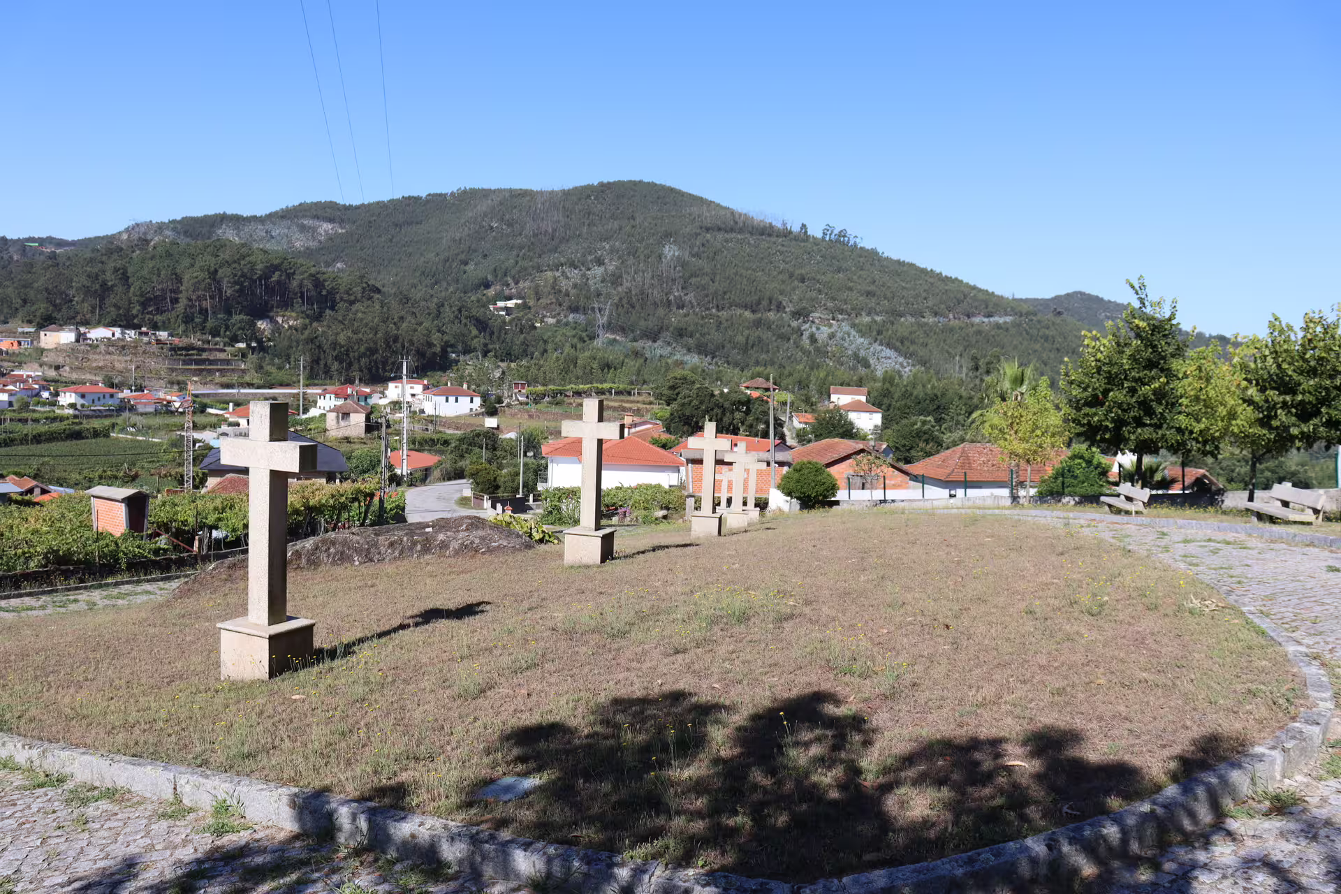 Scenic view of lush green hills and traditional village near Arouca 516 Bridge and Paiva Walkways, perfect for a private tour.