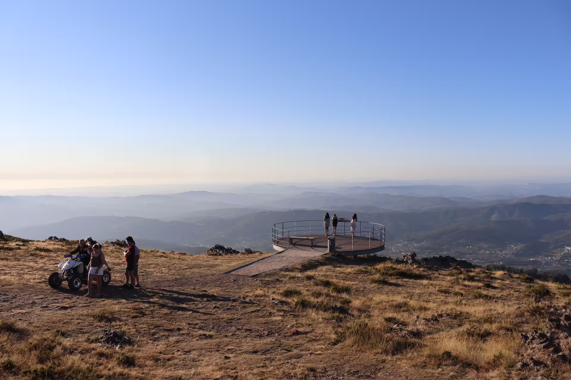 Scenic view from the Arouca 516 Bridge tour, overlooking expansive landscapes and visitors enjoying the Paiva Walkways.
