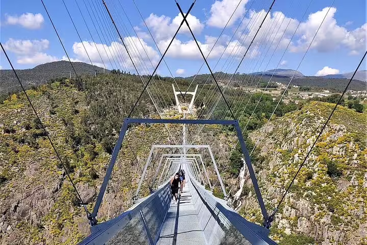Visitors enjoy breathtaking views while crossing the Arouca Suspension Bridge on the scenic Paiva Walkways tour, Portugal.