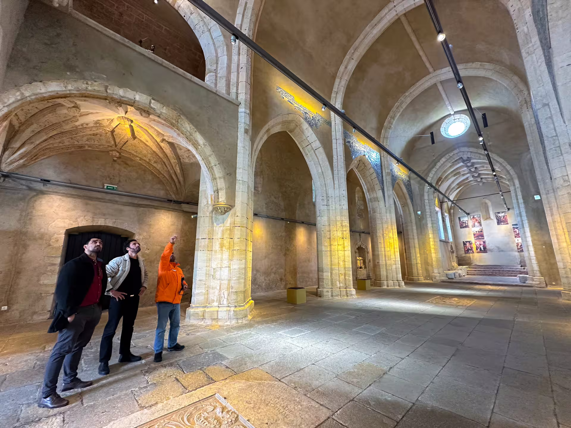 Visitors exploring historic architecture on Arrábida, Setúbal and Blue Coast private van tour.