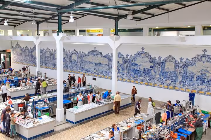 Bustling indoor market in Setúbal with traditional Portuguese tiles, part of the Arrábida tour experience from Lisbon.