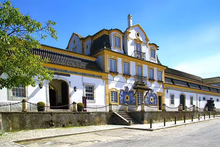 Historic winery in Setúbal region with classic architecture, featured in a private tour to Arrábida, Sesimbra, and wine tasting.