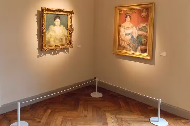 Elegant art gallery corner featuring two framed portraits, highlighting the cultural richness of the private tour.