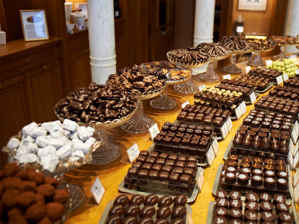 An array of artisan chocolates displayed elegantly in a Saint-Germain shop during the chocolate walking tour.