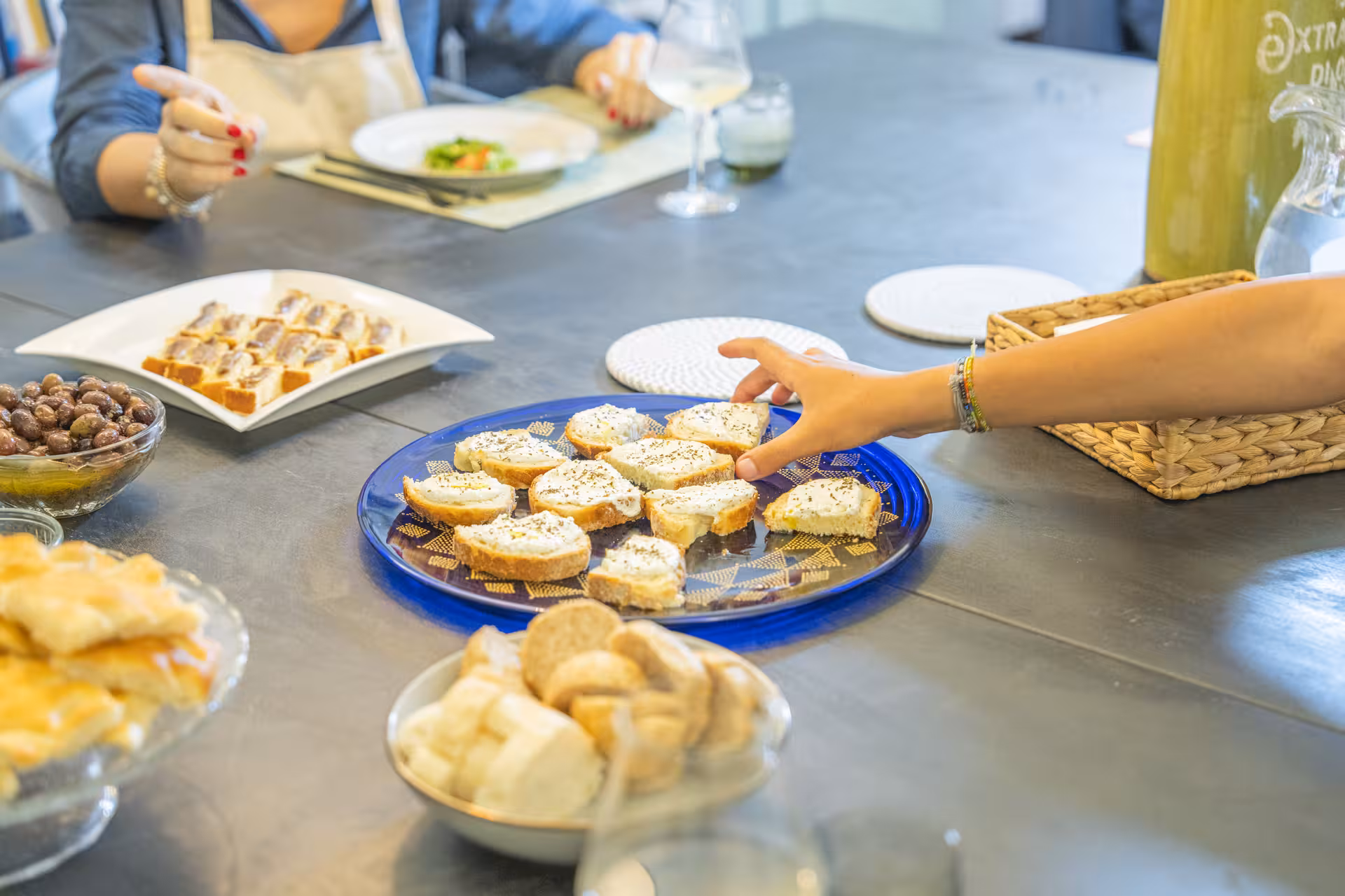 Diverse selection of artisanal dishes at an exclusive private dinner with live cooking show.