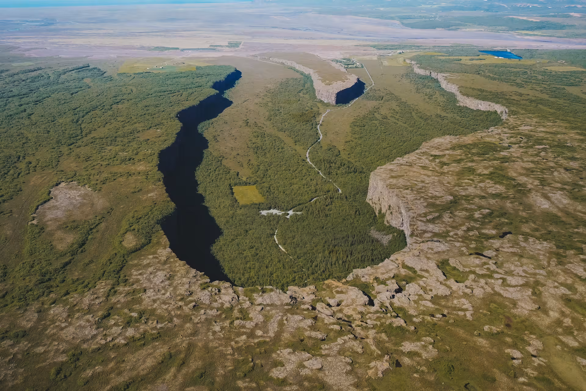 Aerial view of Ásbyrgi Canyon horseshoe cliffs, highlight of a private Diamond Circle tour in North Iceland