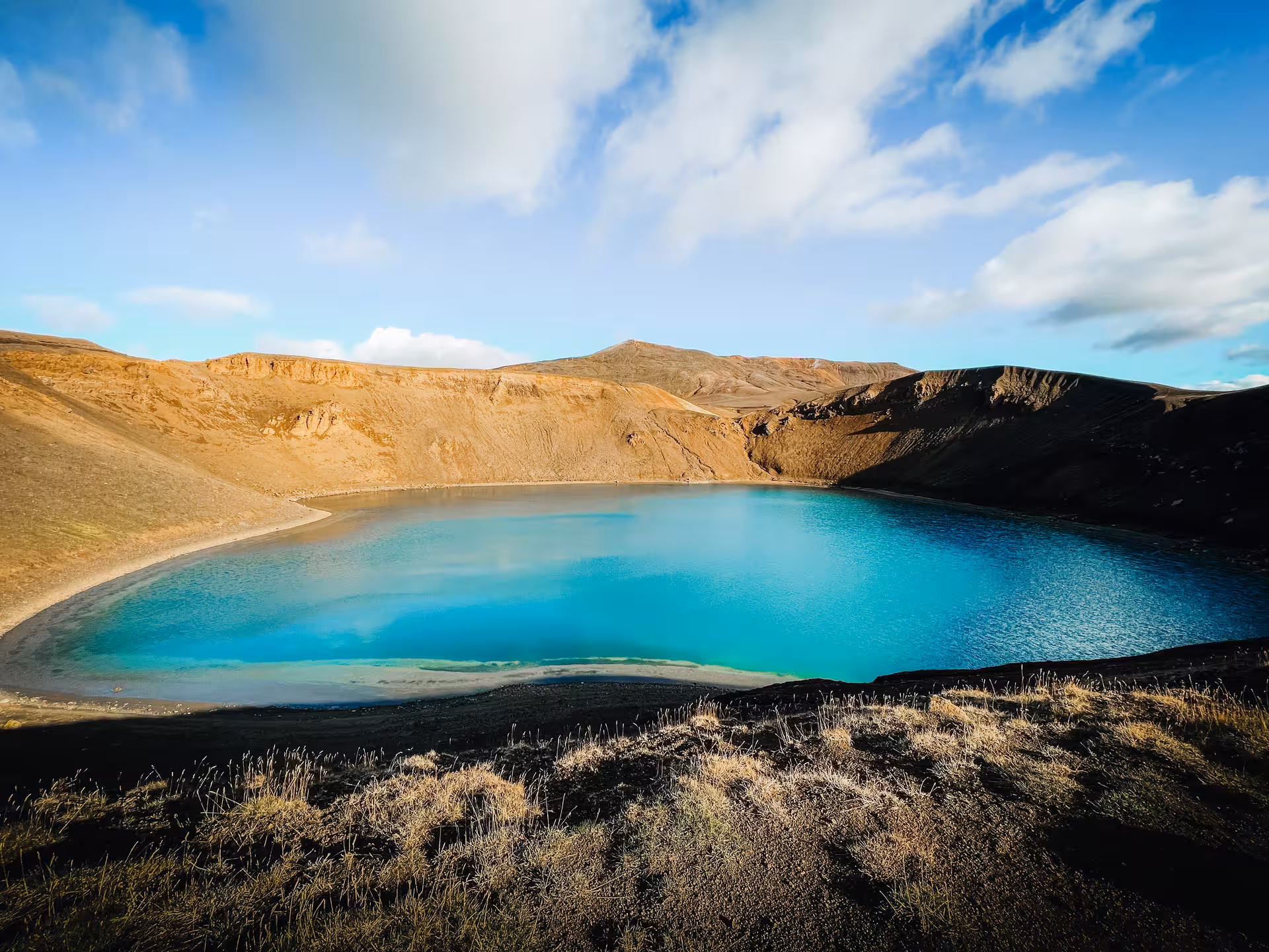 Turquoise crater lake at Askja caldera, a highlight stop on a private Diamond Circle adventure tour