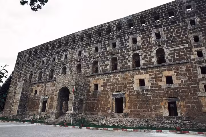 Facade of ancient Roman building on Aspendos Theatre, Perge and Side Antique City day tour from Antalya