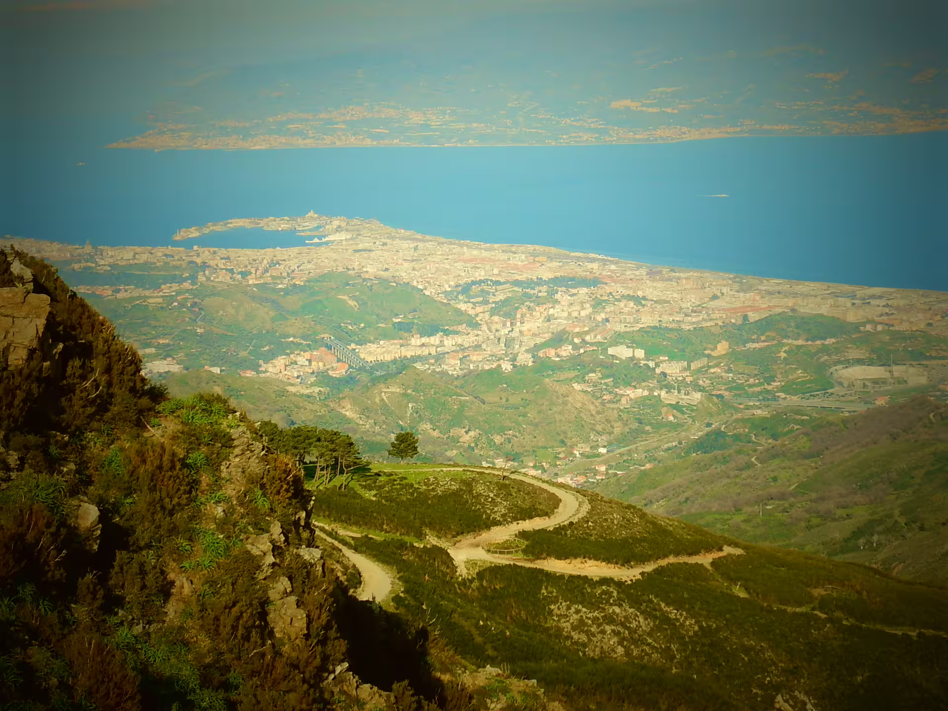 Panoramic view from Aspromonte mountains over Reggio Calabria and Strait of Messina on scenic Princes and Warriors tour