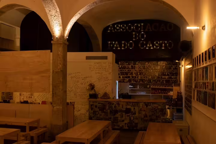 Cozy interior of Associação do Fado Casto in Lisbon, featuring rustic decor for an immersive Fado music evening.